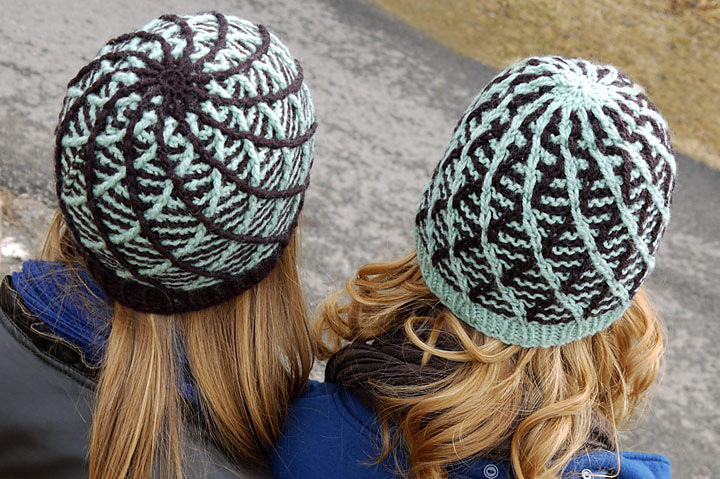 Two crocheted hats in chocolate brown and minty blue 