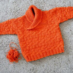 Orange knit Busy Baby Boy sweater in Cotton Fleece