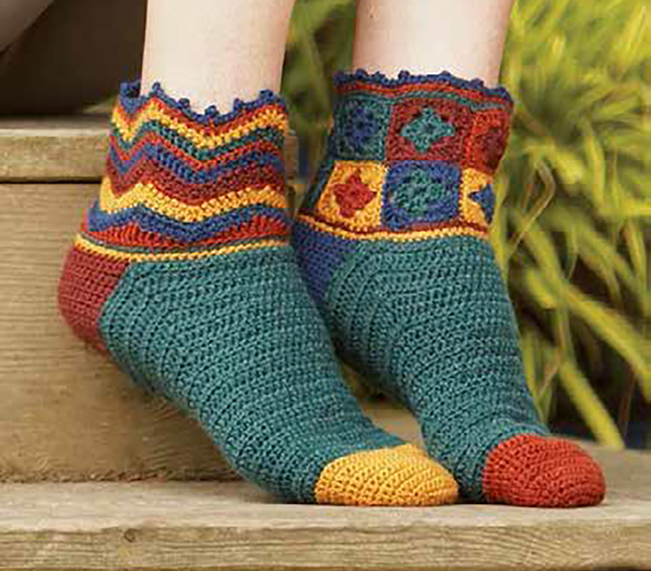 crocheted socks featuring granny squares in red, yellow, green and orange