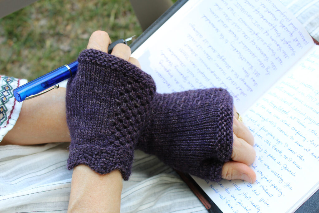 knit fingerless mitts in a deep blue purple with lace accents