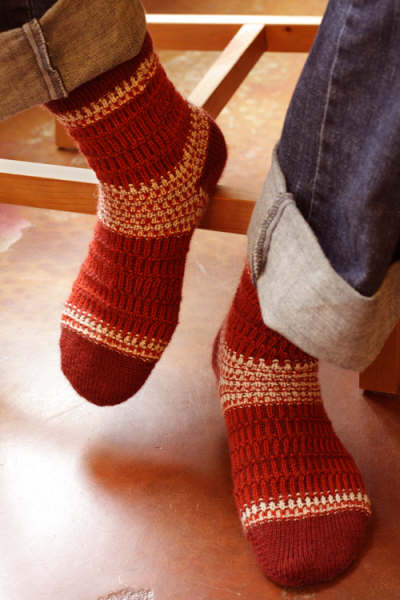 Red and white textured colorwork socks