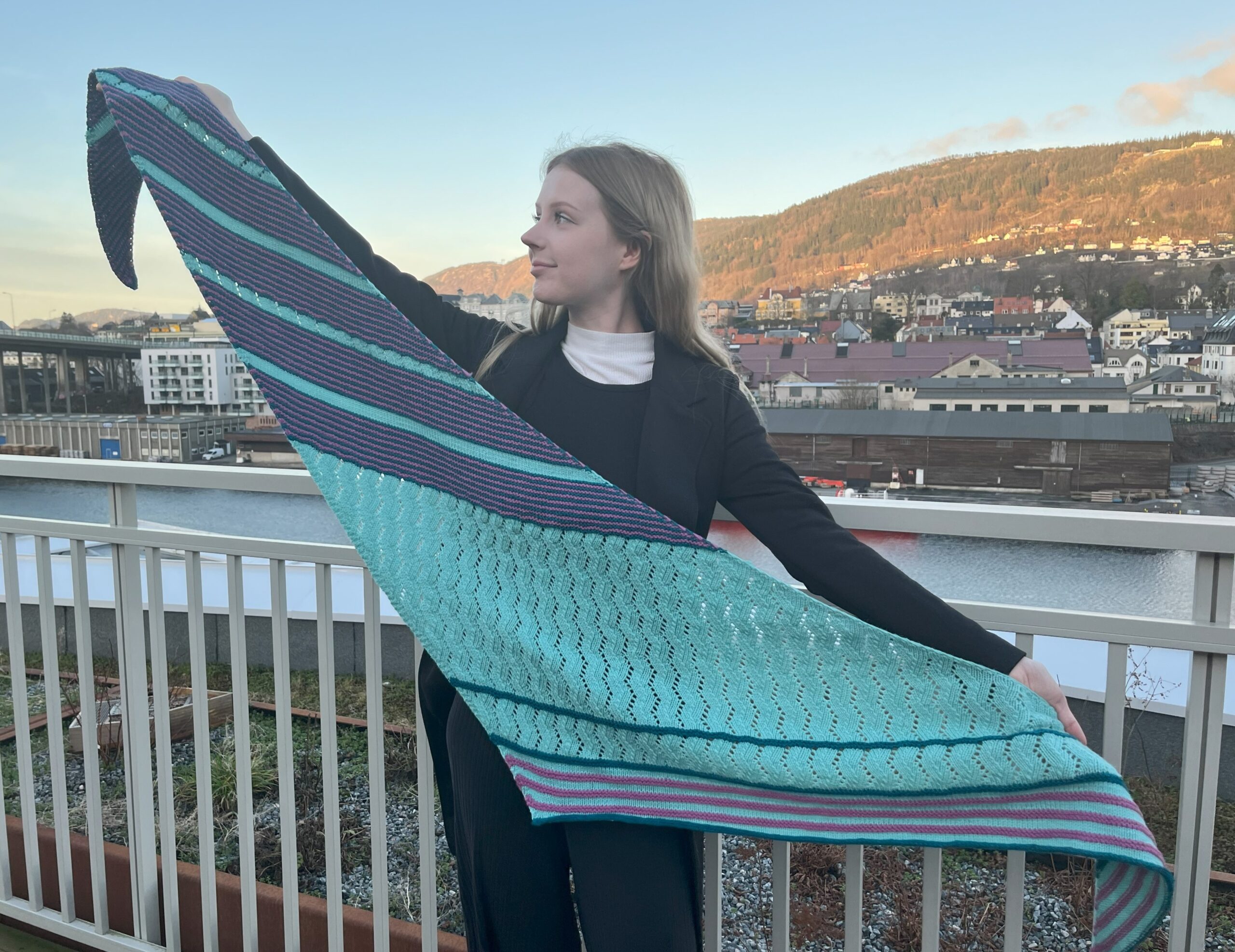 Woman holding lacy multicolor shawl